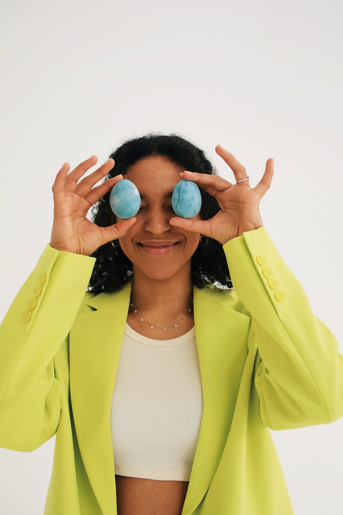 Woman in Bright Green Suit with Easter Eggs